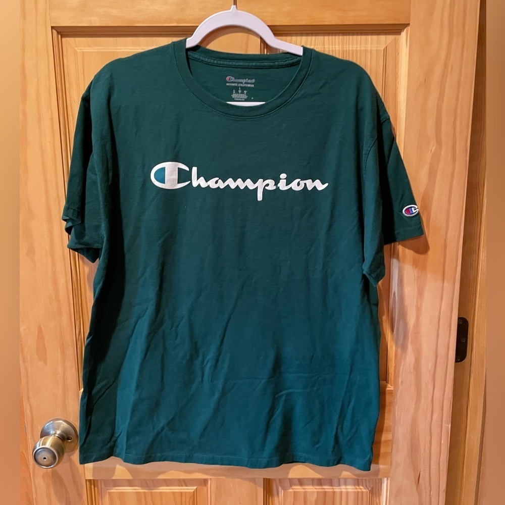 Champions men’s T shirt Green with logo wore one time can be unisex size L